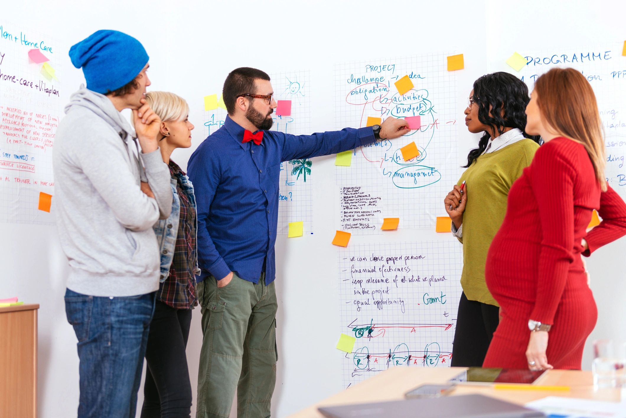 A diverse team collaborating on a project in an office