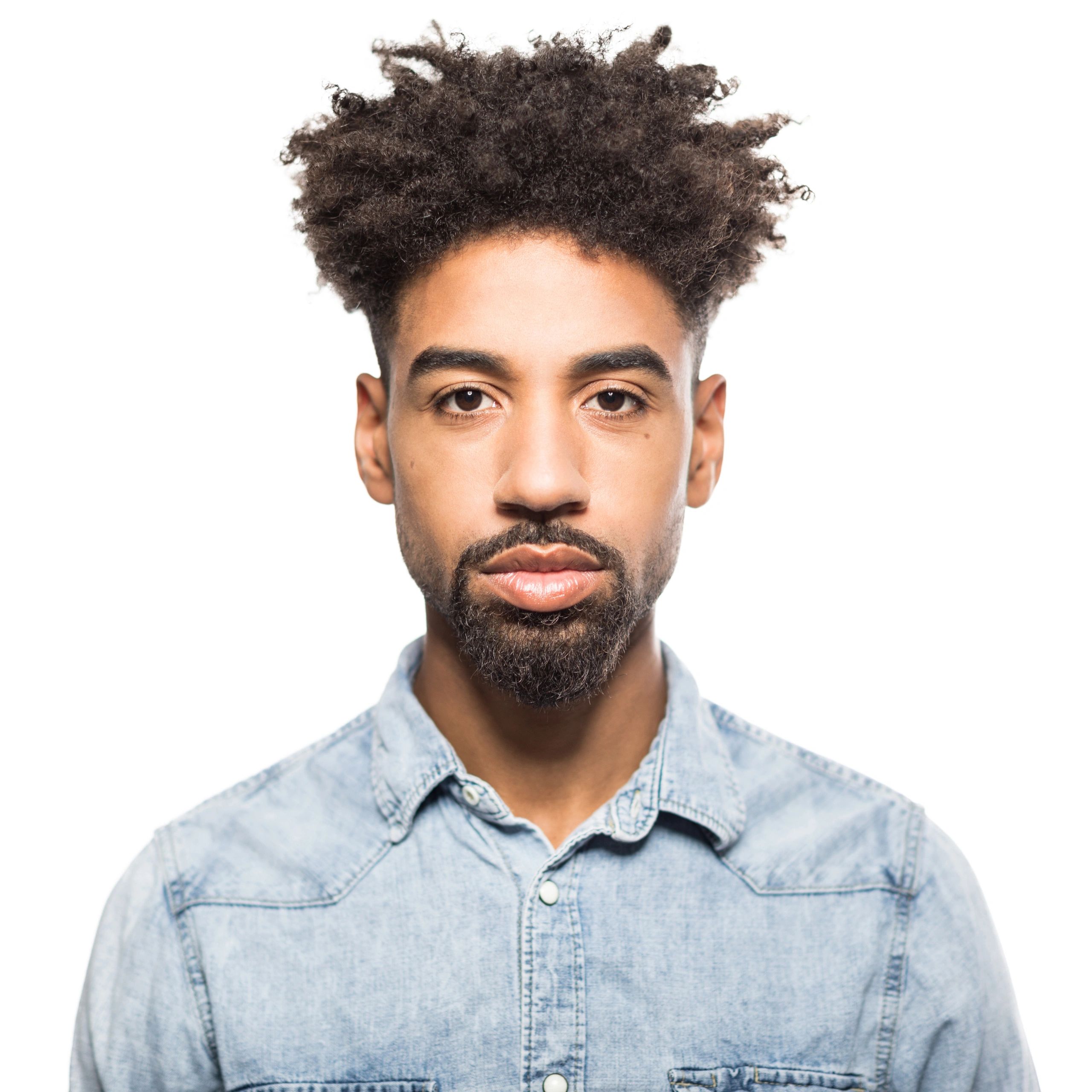Professional headshot of a man against a white background